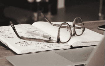 glasses on book