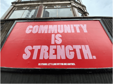 community is strength sign