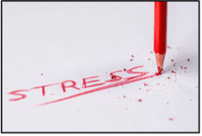 "stress" written in red pencil on white paper