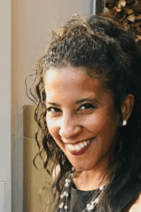 Dawn Morgan, headshot. She is facing forward and smiling against a neutral background.